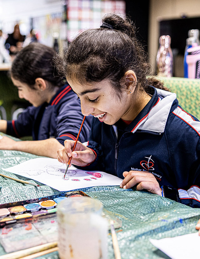 Student painting at Mother Teresa Catholic Primary School Westmead