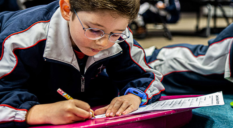 Student with glasses studying at Mother Teresa Catholic Primary School Westmead 