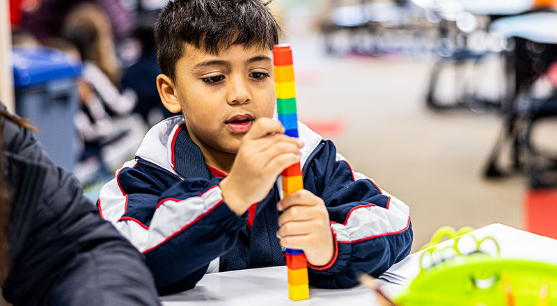 Student playing with building blocks at Mother Teresa Catholic Primary School Westmead