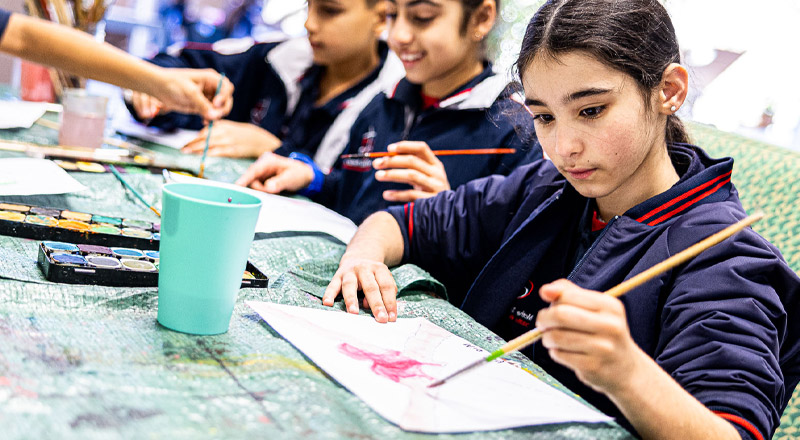 Student painting at Mother Teresa Catholic Primary School Westmead