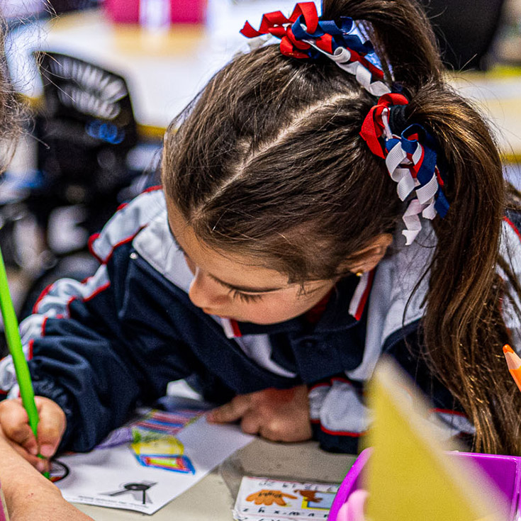 Student with colourful ribbons in hair at Mother Teresa Catholic Primary School Westmead