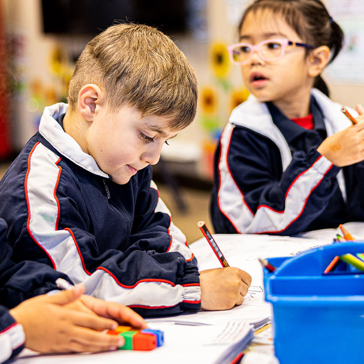Student writing at Mother Teresa Catholic Primary School Westmead