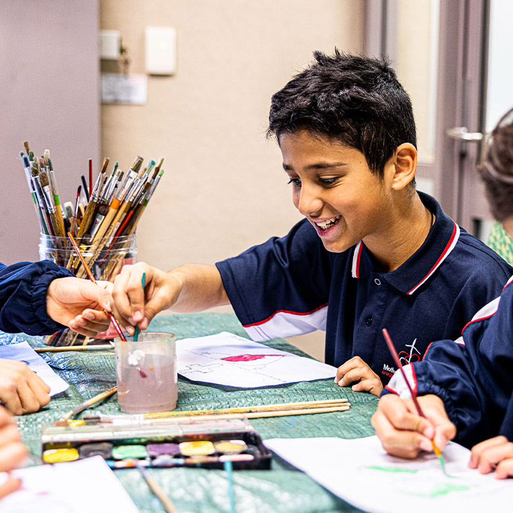 Student painting at Mother Teresa Catholic Primary School Westmead