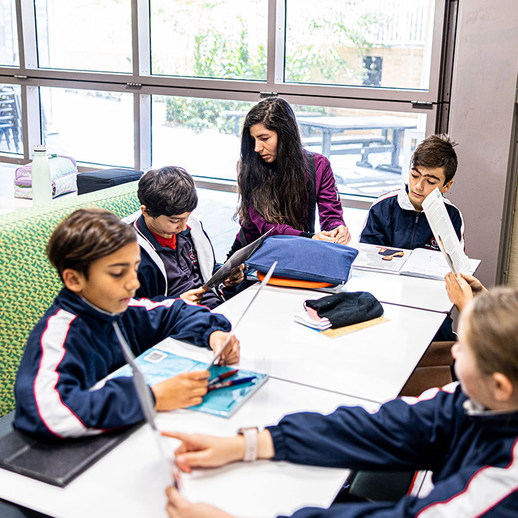 Teacher with students at Mother Teresa Primary Westmead