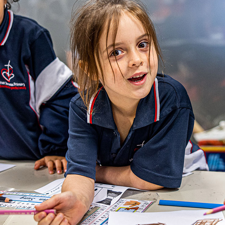 Student grinning at camera from Mother Teresa Catholic Primary School Westmead